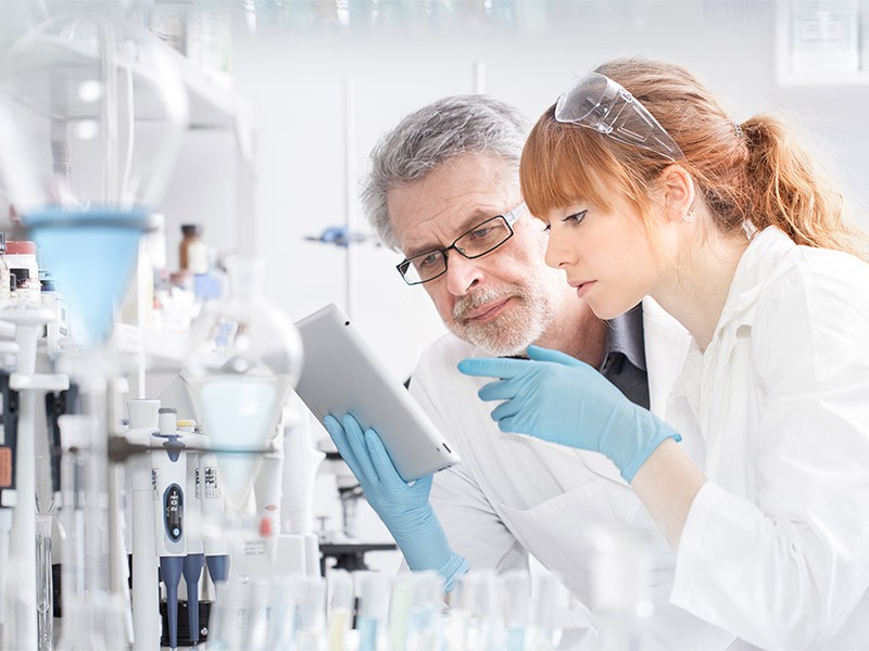 Health care researchers working in life scientific laboratory.